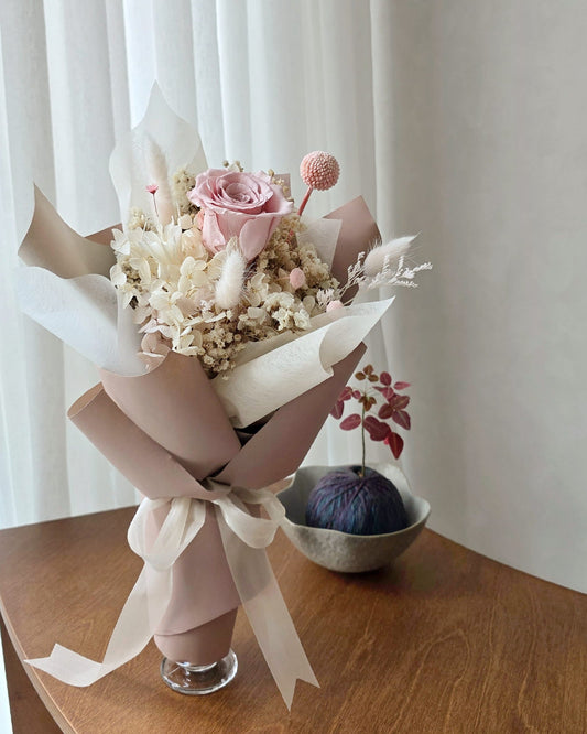 Single blush everlasting rose posy with preserved flowers in neutral wrapping