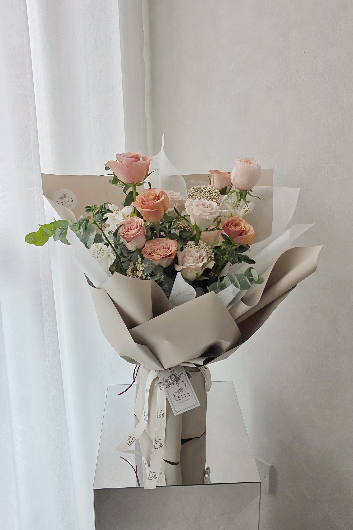 lowers by Terra Antique Rose Bouquet front view — Cappuccino, Catherine Blush, Moab and Menta roses with eucalyptus, soft natural light