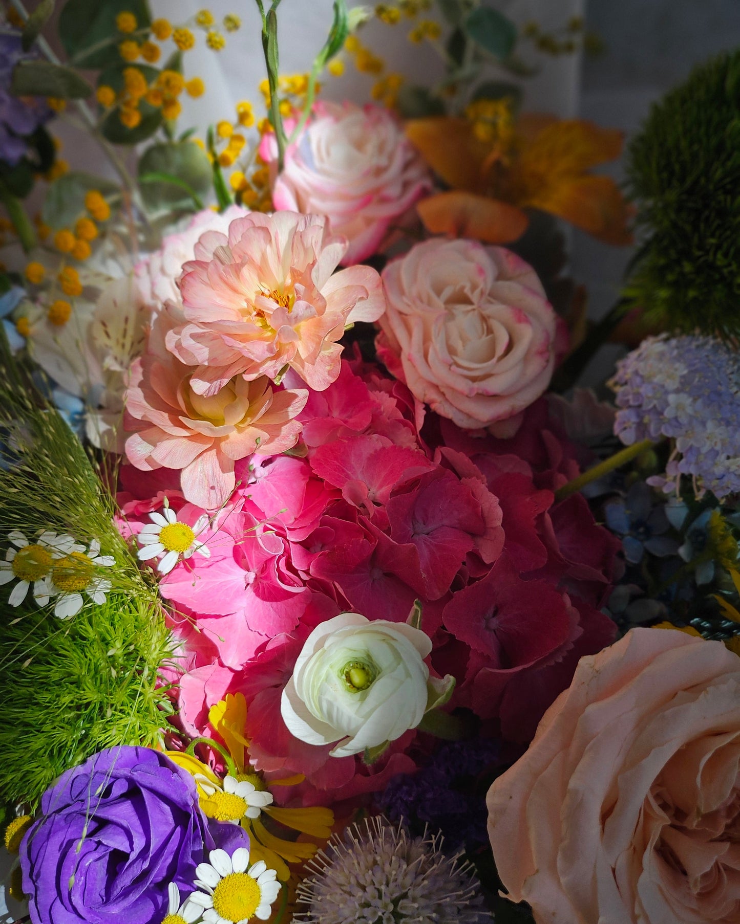 Bright and joyful flower bouquet presented as a gift — colourful omakase arrangement by Flowers by Terra, available for delivery in Singapore