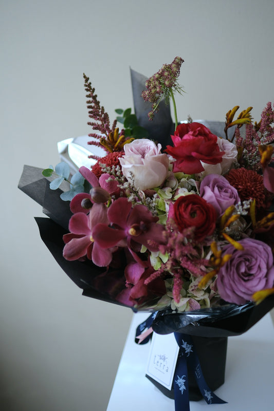 Bold Expressive Bouquet with Orchids Ranunculous Dark Red Filler Flowers