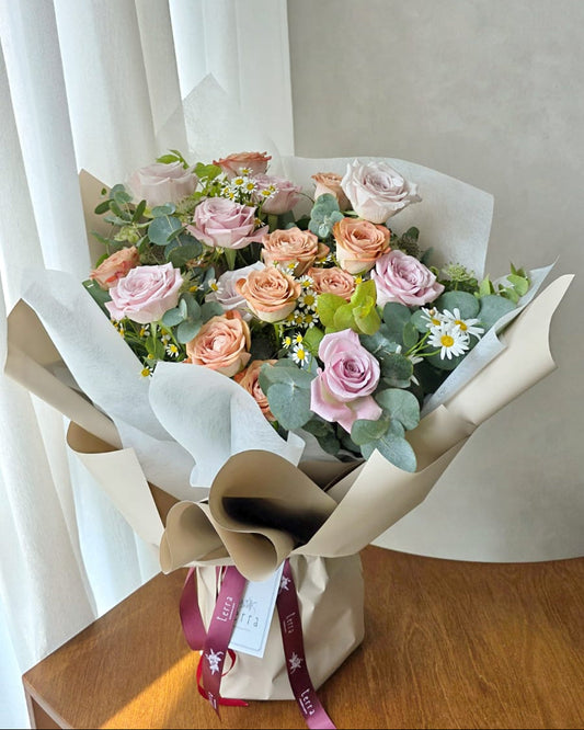 Soft blush and cappuccino roses bouquet by window light, aesthetic flower delivery Singapore