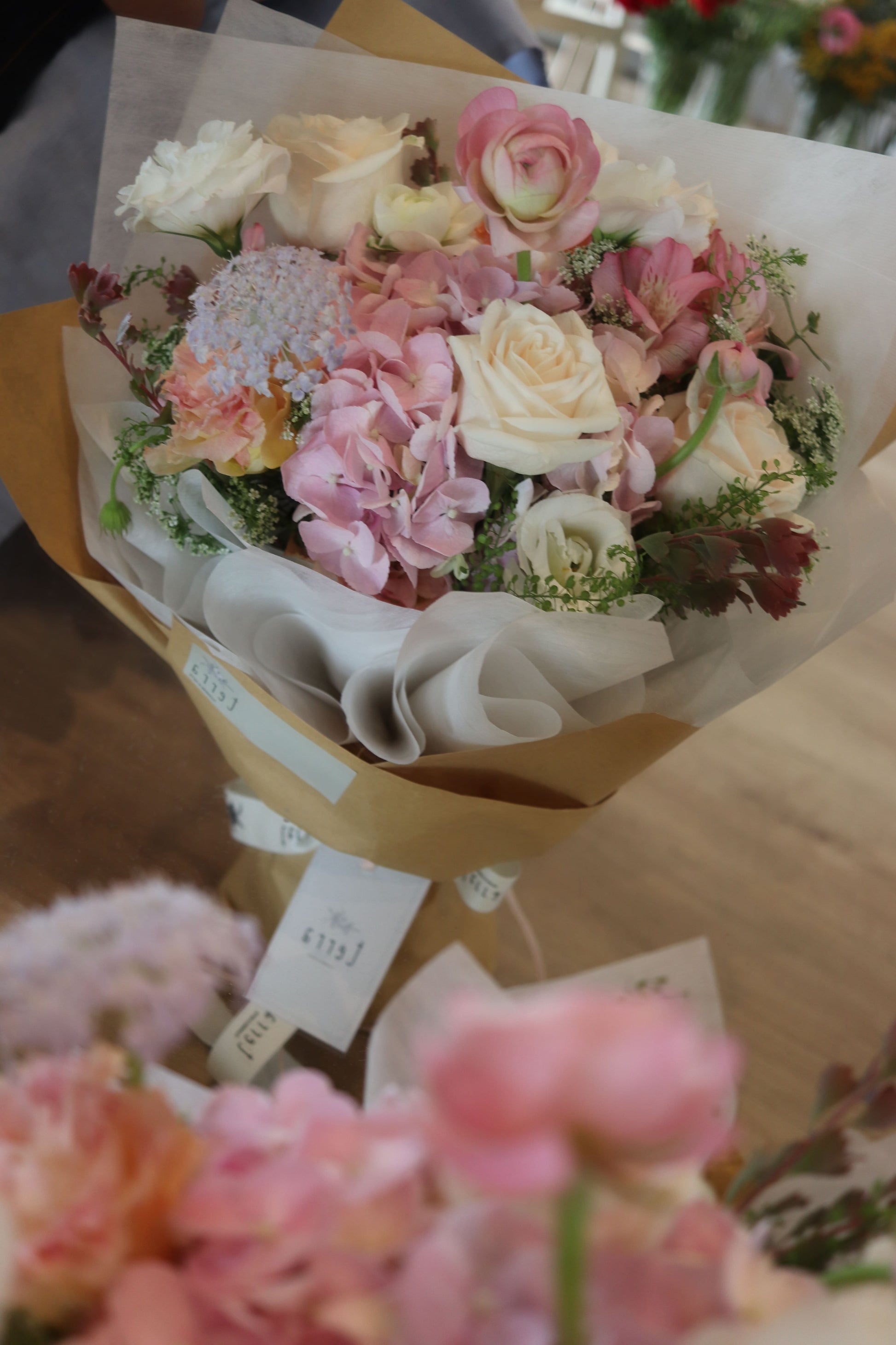  Soft and Pastel Bouquet in Deluxe size with pink hydrangea, roses, ranunculus and seasonal blooms