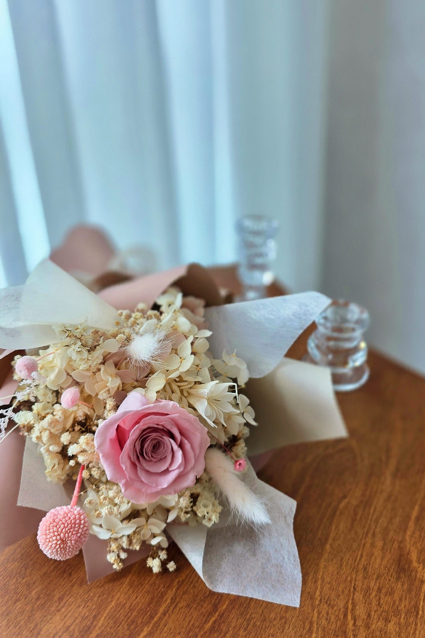 Detail of preserved florals and textures in blush everlasting rose posy
