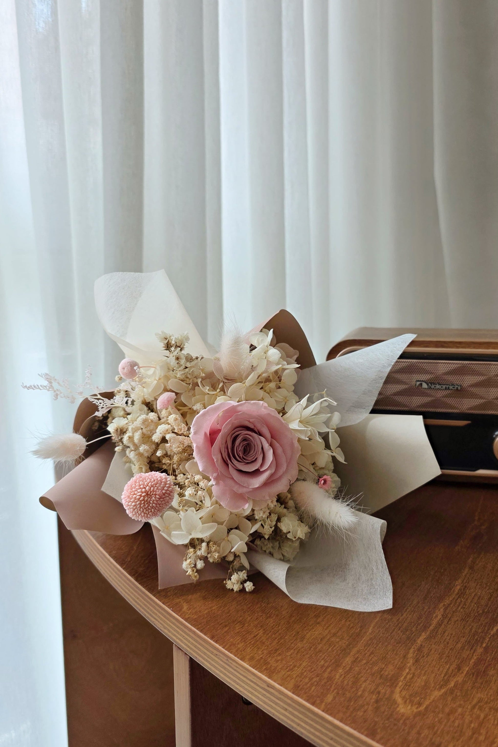 Blush everlasting rose posy styled as a small lasting gift for everyday occasions