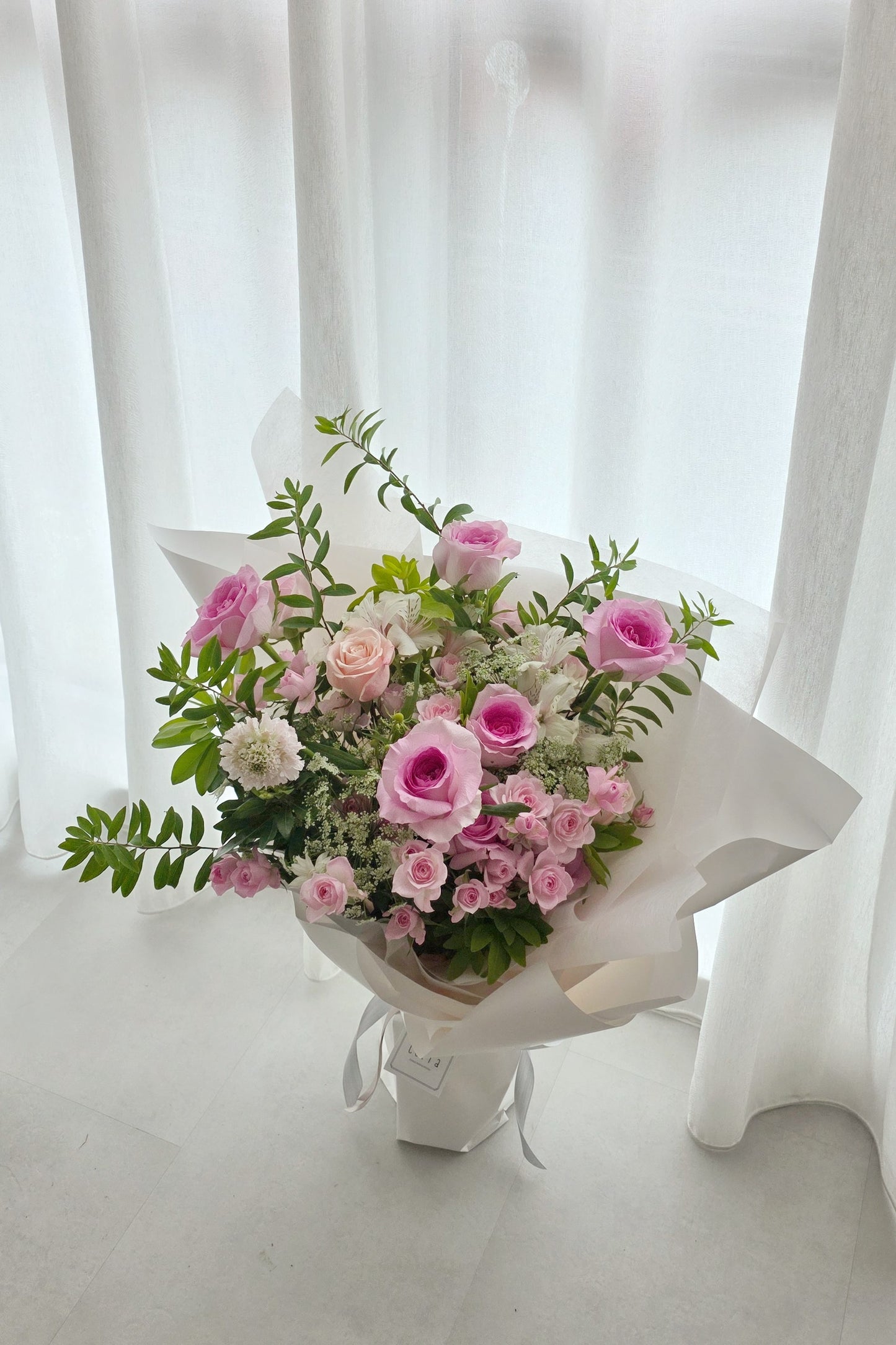 Soft pink rose bouquet handcrafted in Singapore. A romantic Valentine’s Day flower arrangement for heartfelt gifting. Available for delivery.