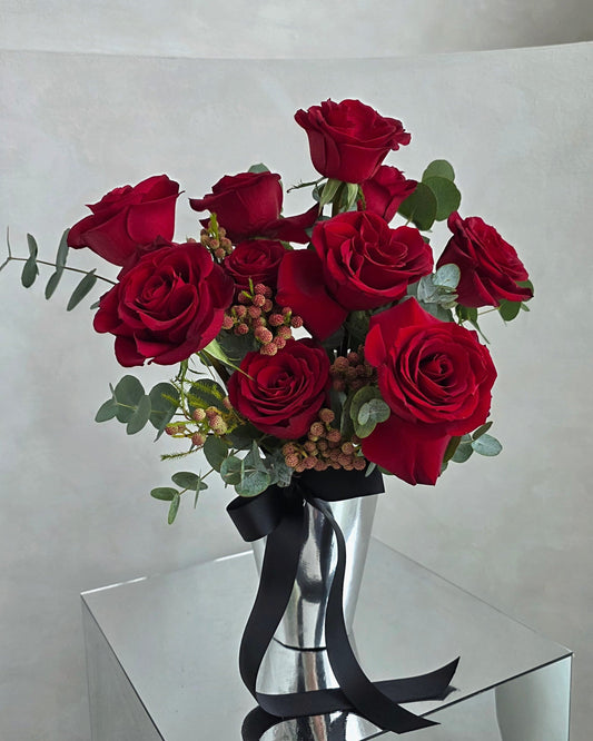 Crimson Reserve red rose vase arrangement with premium roses and modern metallic vessel for Valentine’s Day