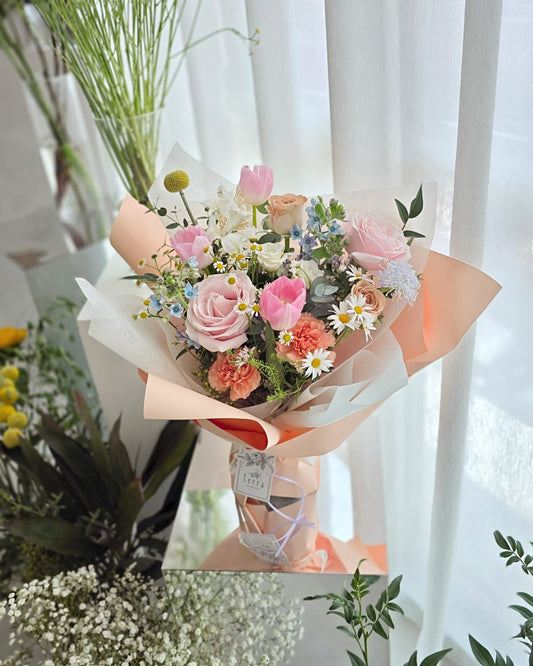 Lush Mother's Day bouquet with soft pink roses, blush tulips, champagne blooms and wildflowers in peach and cream wrap — Her Garden by Flowers by Terra Singapore