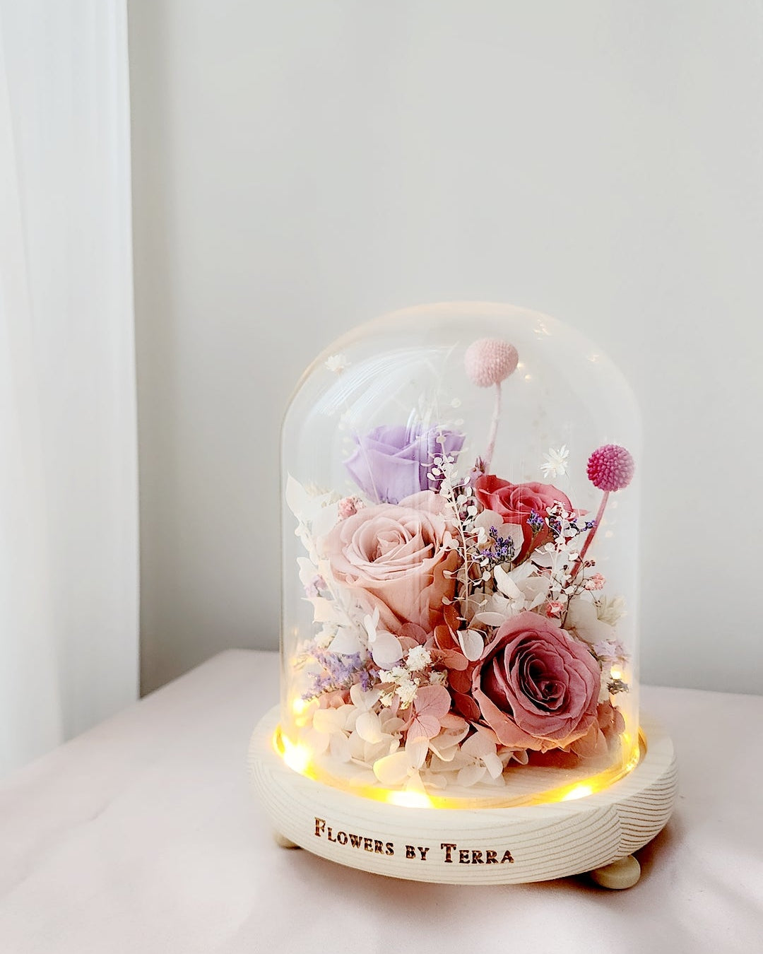 Preserved flower dome styled as elegant home décor for everyday gifting