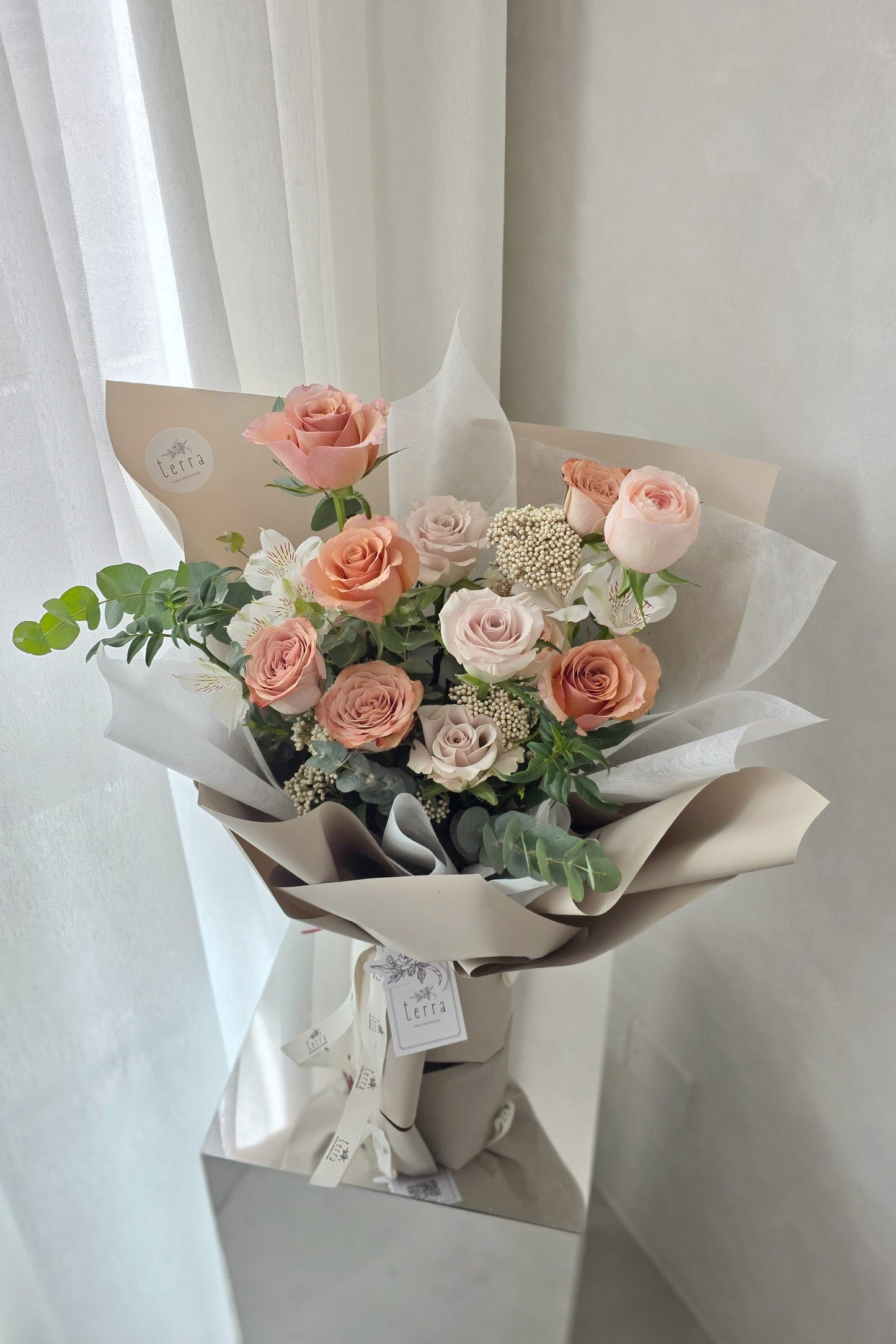 Flowers by Terra Antique Rose Bouquet front view — Cappuccino, Catherine Blush, Moab and Menta roses with eucalyptus, soft natural light